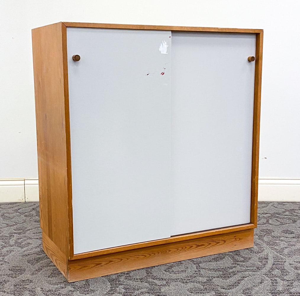 SWEDISH PINE CABINET C. 1960S: Painted sliding doors. Sweden, circa 1960s Dimensions: H 35" x W 31.5" x D 16.25" Condition: Dings and scratches to top and sides, Wear consistent with age and use, including discoloration and surface