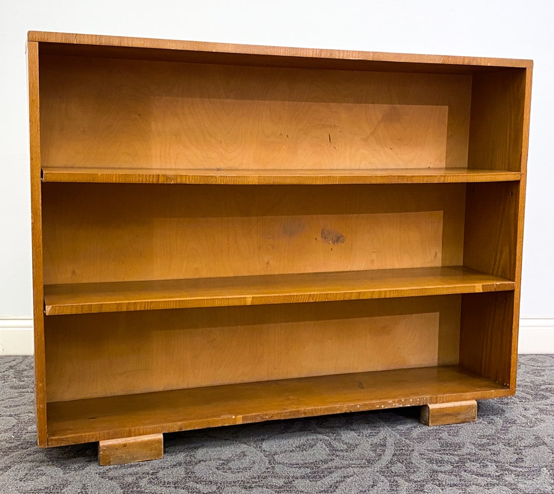 MID-CENTURY SCANDINAVIAN OAK BOOKCASE: Apparently unmarked. Dimensions: H 37.5" x W 49.25" x D 10" Condition: Water rings to top and shelves, Scratches and rubs to top and sides, Wear consistent with age and use. Shelf tabs broken. Shelves