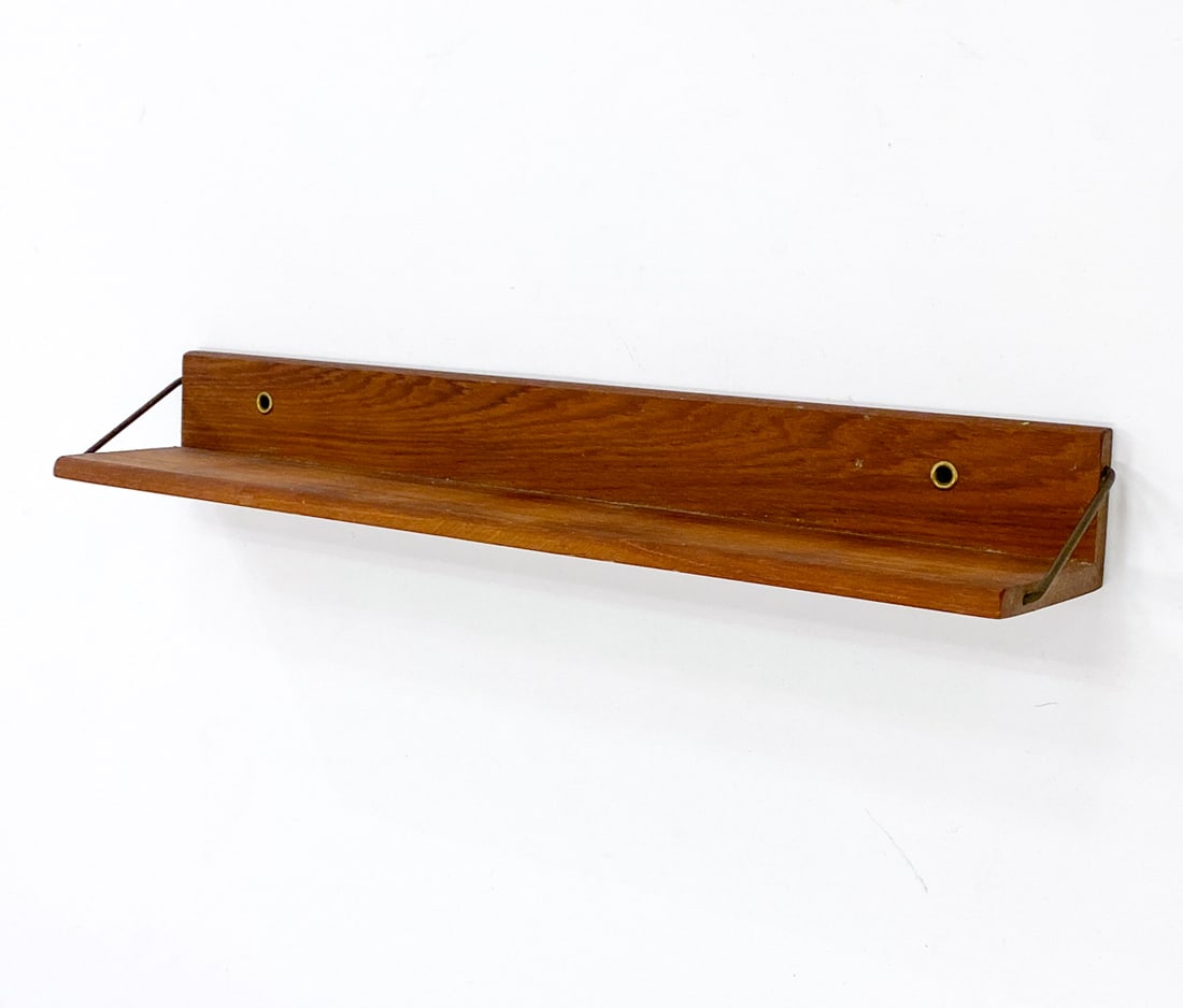 SCANDINAVIAN TEAK WALL SHELF: Marked on backside. Dimensions: H 2" x W 16.5" x D 3" Condition: Wear consistent with age and use including rubs and scratches.