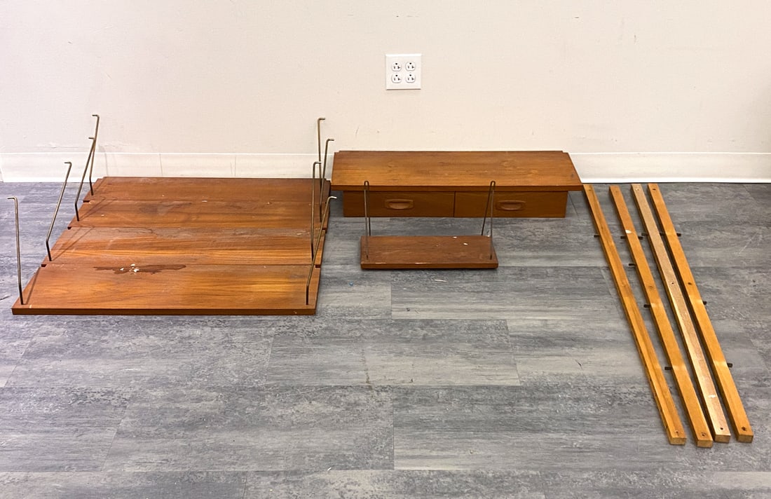 DANISH TEAK WALL SHELF SYSTEM C. 1960S: Dimensions: H 4" x W 32" x D 12" Condition: Wear consistent with age and use. Nicks, minor dings, ribs, scuffs, paint residue, patina, some fading. As is.