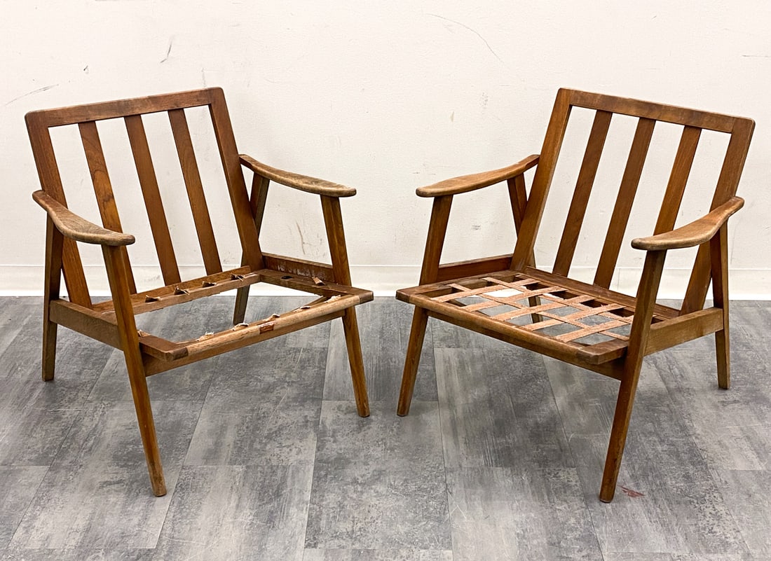 PAIR OF MID-CENTURY DANISH TEAK CHAIR FRAMES: Unmarked. For restoration. Dimensions: H 29" x W 26.5" x D 27" Condition: Lacking cushions, one chair missing straps. Straps with drying and cracking. Sun fading, scratches, rubs, wear consistent