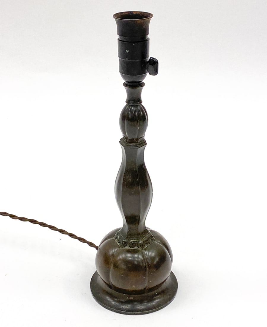 JUST ANDERSEN D60 DISKOMETAL TABLE LAMP C. 1920S: Marked underneath. Denmark, circa 1920s. Dimensions: H 15" x Dia 5" Condition: Wear consistent with age and use. Untested. Some patina. Minor rubs to socket.