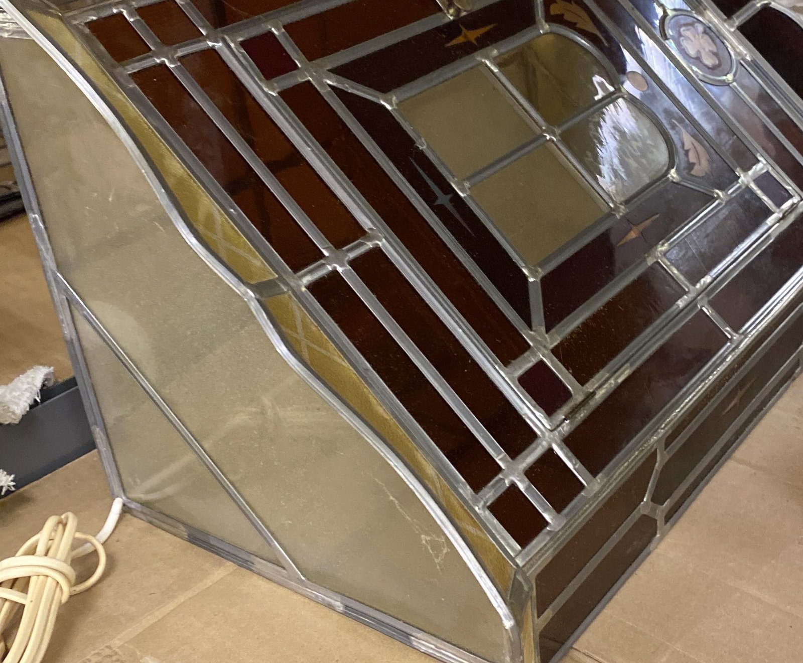 DANISH STAINED GLASS VANITY CORNER CABINET: Apparently unmarked. Dimensions: H 21" x W 17" x D 10" Condition: Wear consistent with age and use. Wiring untested. Two inch hairline crack to back.