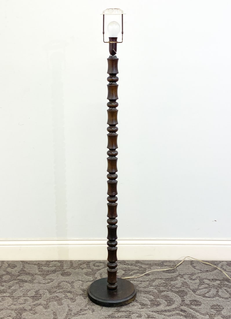 SCANDINAVIAN TURNED PINE FLOOR LAMP: Stained pine lamp. Unmarked. Dimensions: H 54.5" x Dia. 9.75" Condition: Not tested, Faint dings and rubs to lamp stem, Wear consistent with age and use.