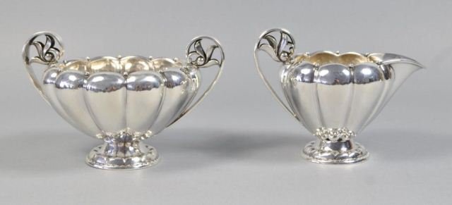 GEORG JENSEN STERLING SILVER CREAMER & SUGAR: Sterling silver creamer and sugar made by George Jensen. Hallmarked Georg Jensen, Denmark Sterling, 178B & 179 B. In excellent condition. Dimensions: 9.5" H X 8" L X 5" W Total weight: 17.47 ozt From 