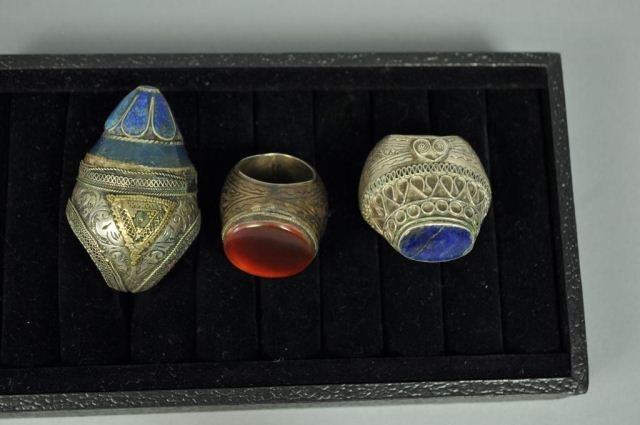 GROUP OF 3 BERBER SILVER LAPIS & CARNELIAN RINGS: Grouping of 3 large Berber silver rings. Two with lapis stones, one with carnelian stones. Dimensions: 2.5" on largest side. Ring sizes: 6, 8 & 9 From a Port Chester, NY Estate