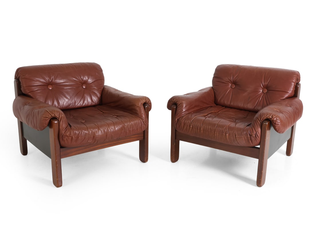 PAIR COJA STYLE BRUTALIST LEATHER LOUNGE CHAIRS: Sweden, circa 1970s. Dimensions: H 27.5" x W 33" x D 35" x SH 16.5". Condition: Scratches and dings to frames. Light scuffs to leather. Wear consistent with age and use. PT020