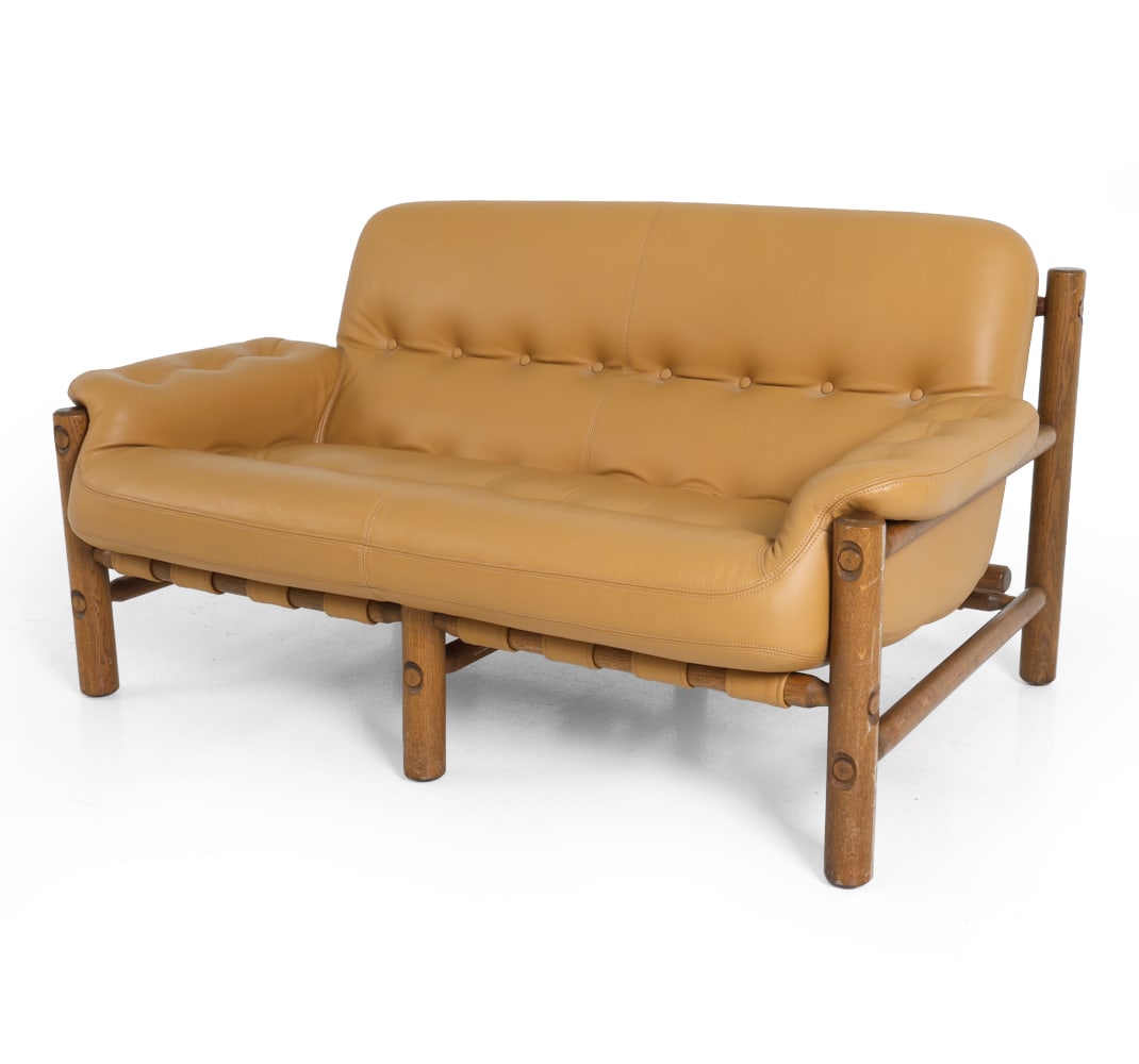ARNE NORELL STYLE OAK & LEATHER LOVESEAT 1960S: Dimensions: H 32" x W 52" x D 35" x SH 16". Condition: Light scratches and sun fading to wood, wear consistent with age and use. PT106