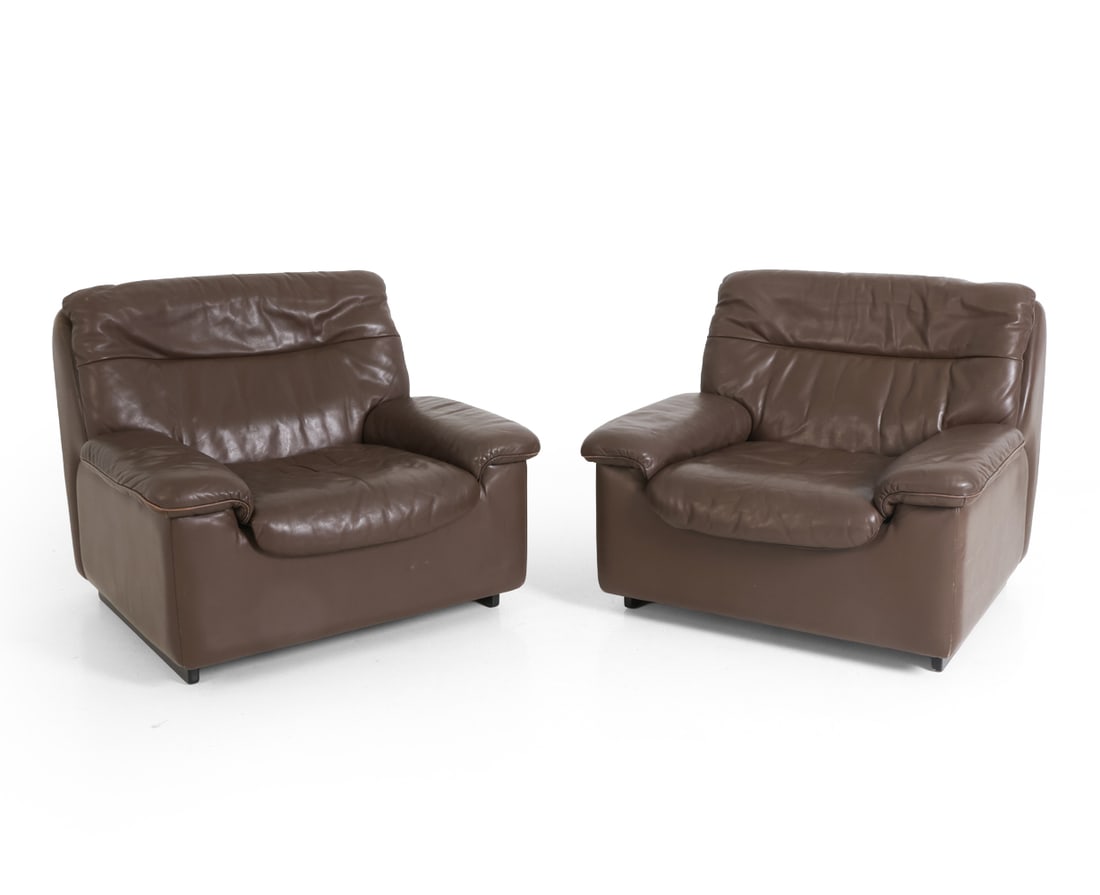 PAIR DE SEDE DS-66 LEATHER LOUNGE CHAIRS C. 1970S: Marked to lining under cushions. Switzerland, circa 1970s. Dimensions: H 31" x W 33" x D 36" x SH 16". Condition: Light scuffs to leather, wear consistent with age and use. PT190