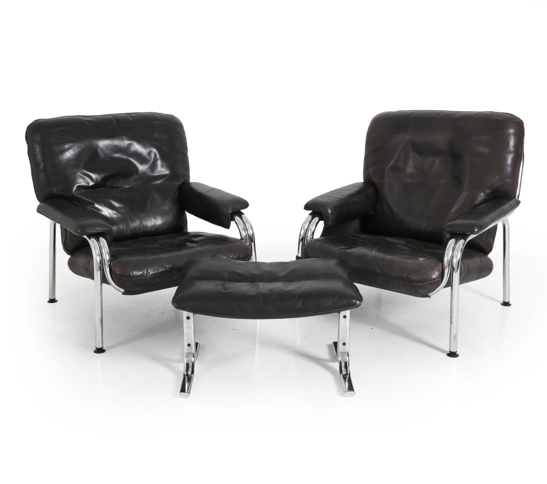 EICHENBERGER DE SEDE KANGAROO CHAIRS & OTTOMAN: Two Kangaroo lounge chairs and footstool designed by Hans Eichenberger for de Sede. Leather seats and chromed metal frame. Marked underneath. Swiss, circa 1970s. Dimensions: (chairs) H 33" x W 32.5" x