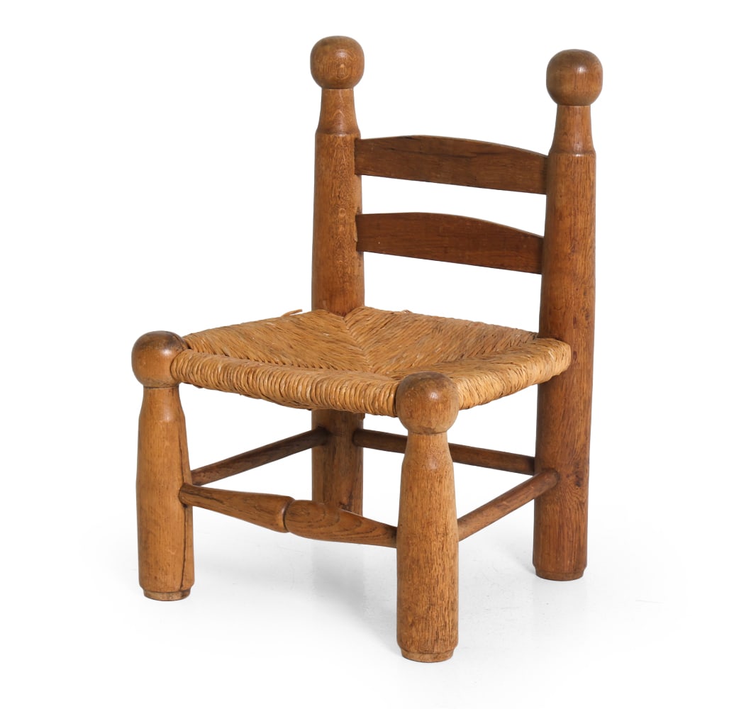 ATTR. CHARLES DUDOUYT CHILDREN' S OAK & RUSH CHAIR: Apparently unmarked. Circa 1950s. Dimensions: H 24.25" x W 16.25" x D 14.5" x SH 11.5". Condition: Previous repair to seat. Wear consistent with age and use. PPT097