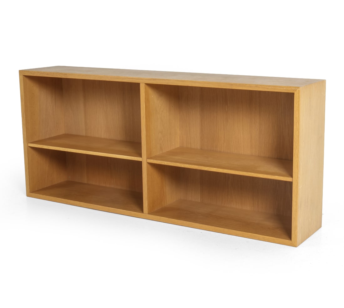 BORGE MOGENSEN OAK BOOKCASE C. 1960S: With two mounting holes present for possible wall mounting. Marked to back corner. Denmark, circa 1960s. Dimensions: H 23.25" x W 53.25" x D 10.25". Condition: Scuffs and scratches. Few small losses t
