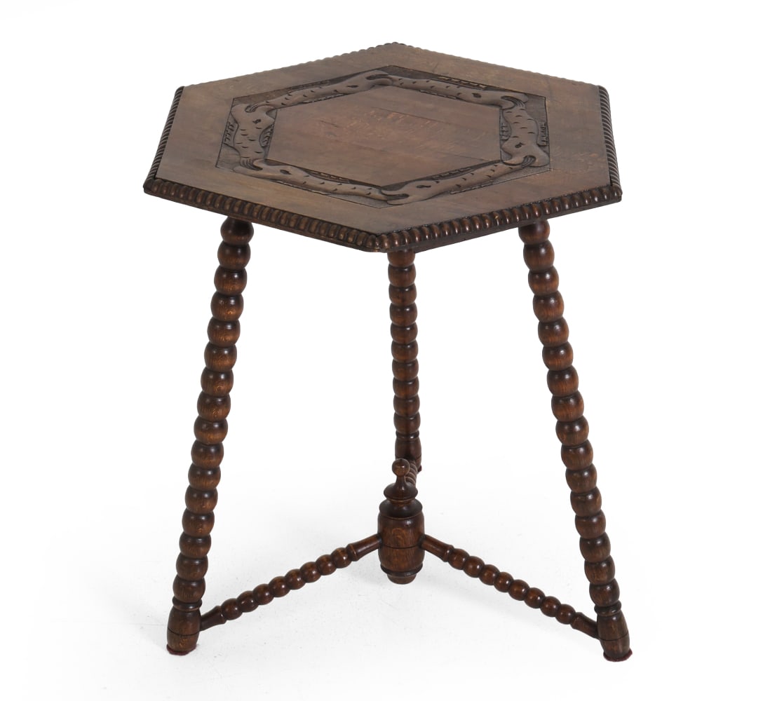 DUTCH ART DECO BOBBIN TURNED OAK SIDE TABLE 1930S: The top with carved fish biting on each others tail in a circle. Dimensions: H 24" x Dia. 22.5". Condition: Water spots and few stress splits to top. Wear consistent with age and use. Previous repairs