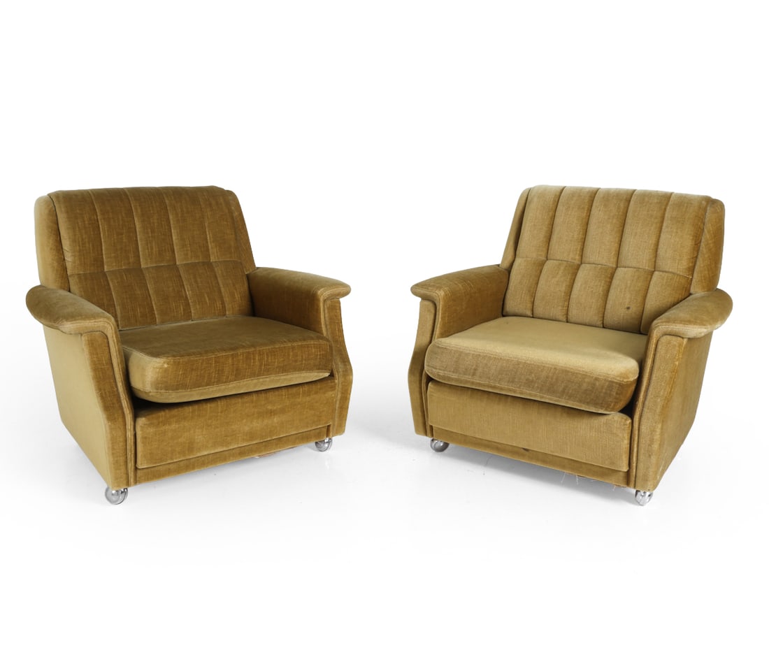 PAIR OF DANISH VELOUR LOUNGE CHAIRS C.1960S: Dimensions: H 27" x W 27.5" x D 24" S.H. 16" Condition: Missing cap to one caster. Under lining ripped, some apparent soiling. Small tear in corner of seat cushion. Wear consistent with age and use. P
