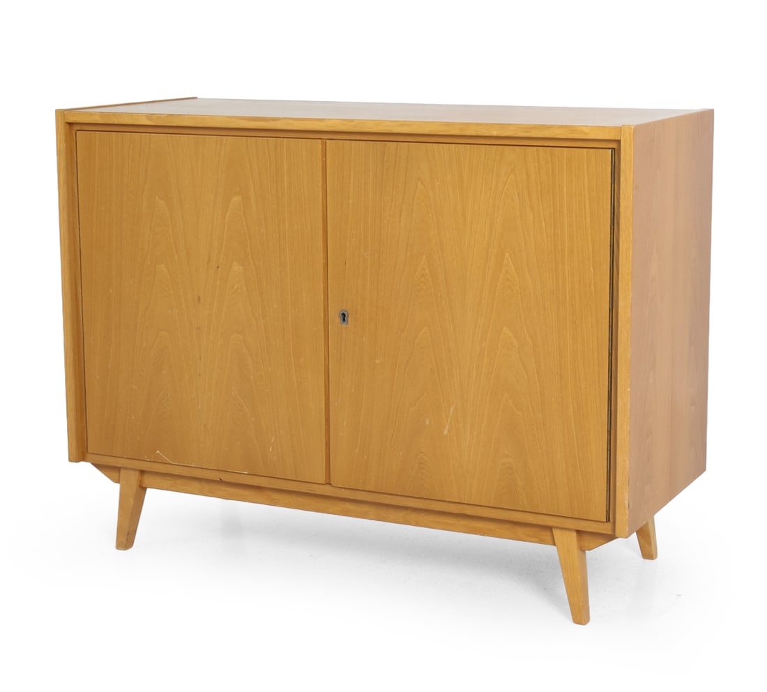 ATTR. JIRI JIROUTEK CZECH BIRCH CABINET C. 1960S: Key included. Remnants of label marked to back. Czechoslovakia, circa 1960s. Dimensions: H 29.5" x W 39.5" x D 16". Condition: Scuffs and scratches. Wear consistent with age and use. PT070