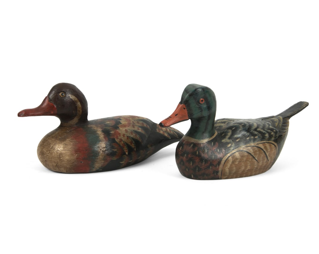 ANTIQUE SCANDINAVIAN WOODEN DUCK DECOYS C. 1920S: Dimensions: (larger) H 5.5" x W 13" x D 5.5" (smaller) H 5.5" x W 13" x D 4" Condition: Wear consistent with age and use. Some scratching on top and bottom and wear of paint on bottom. PT156