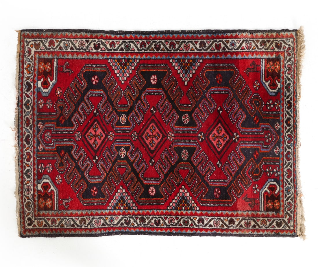 VINTAGE PERSIAN WOOL RUG: Dimensions: L 57.5" x W 41.5". Condition: Fading and losses to fringe. Wear consistent with age and use. PT122