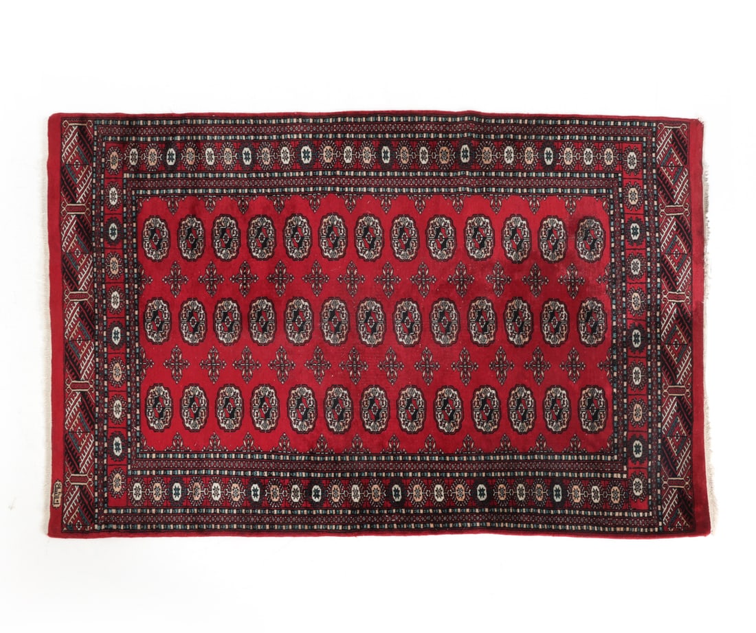 VINTAGE PERSIAN BOKHARA WOOL RUG: Signed to corner. Dimensions: L 76" x W 49.5". Condition: Fading and losses to fringe. Wear consistent with age and use. PT123
