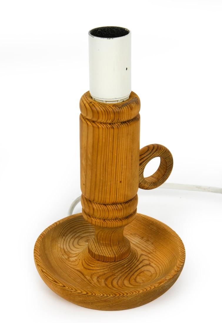 SWEDISH PINE CANDLESTICK FORM TABLE LAMP C. 1970S: Marked on bottom indistinctly. Sweden, circa 1970s. Dimensions: H 7.5" x W 4.25" Condition: Wear consistent with age and use. Finish slightly worn. Scratches on base and spindle. European plug. Untest