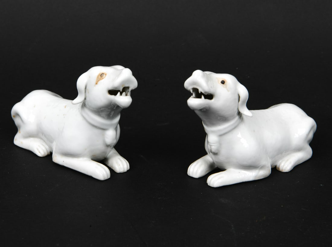 PAIR CHINESE BLANC DE CHINE PORCELAIN DOGS: Apparently unmarked. Dimensions: H 2.5" x W 4.5" x D 2". Condition: Light scuffs and surface soiling. Wear consistent with age.