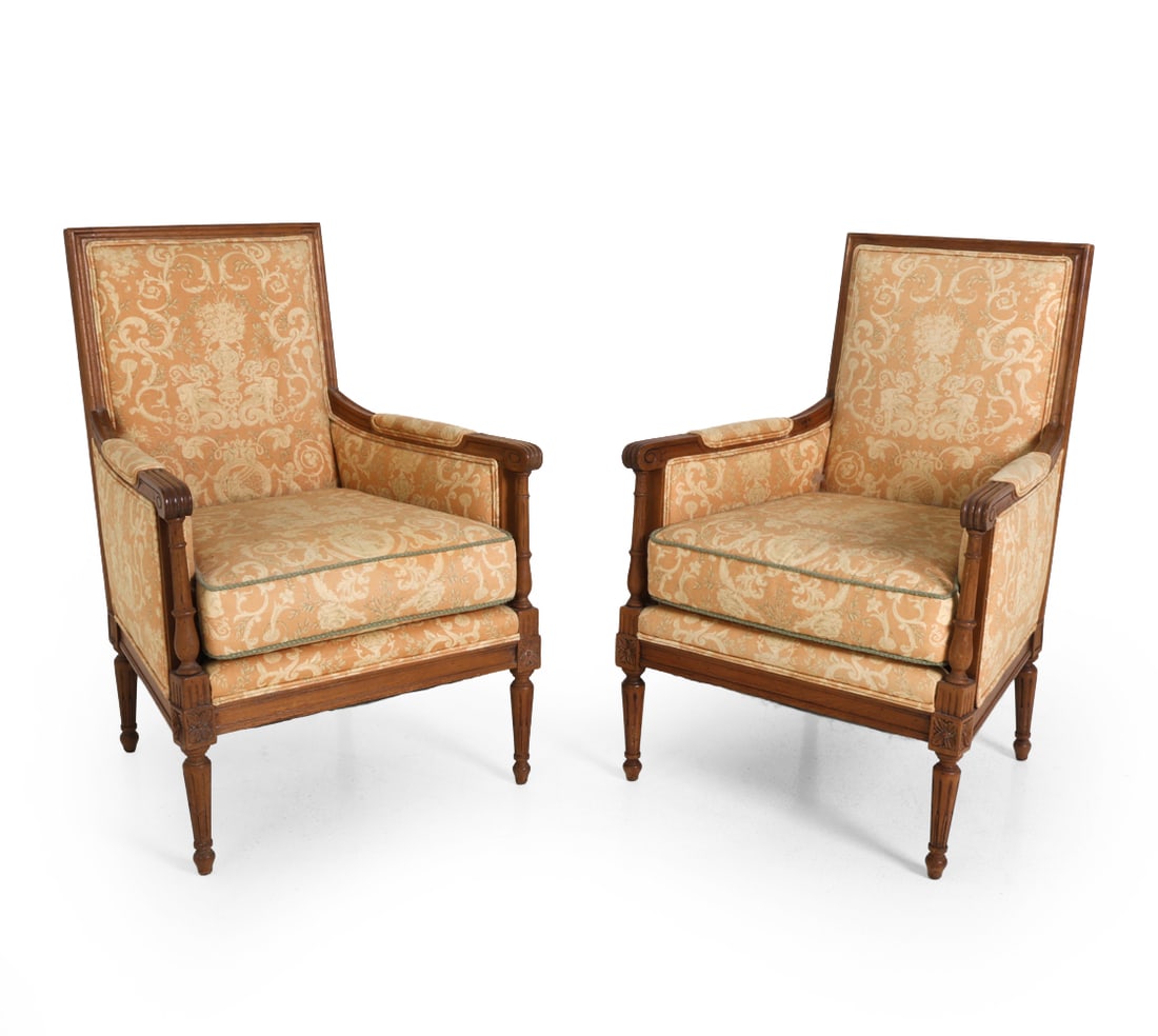 PAIR OF LOUIS XVI STYLE BERGERE CHAIRS: Dimensions: H 36.5" x W 25" x D 22.5" x SH 17.5". Condition: Fading to fabric. Pet hair. Scuffs to wood. Wear consistent with age and use.