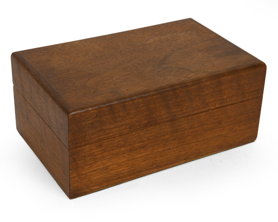 ALFRED DUNHILL TEAK HUMIDOR BOX C. 1930S: Made by Alfred Dunhill of London as marked inside box. London, circa 1930s. Dimensions: H 4" x W 8.5" x D 5.25" Condition: Scuffs, water marks, and slight loss of finish. Wear consistent with age and