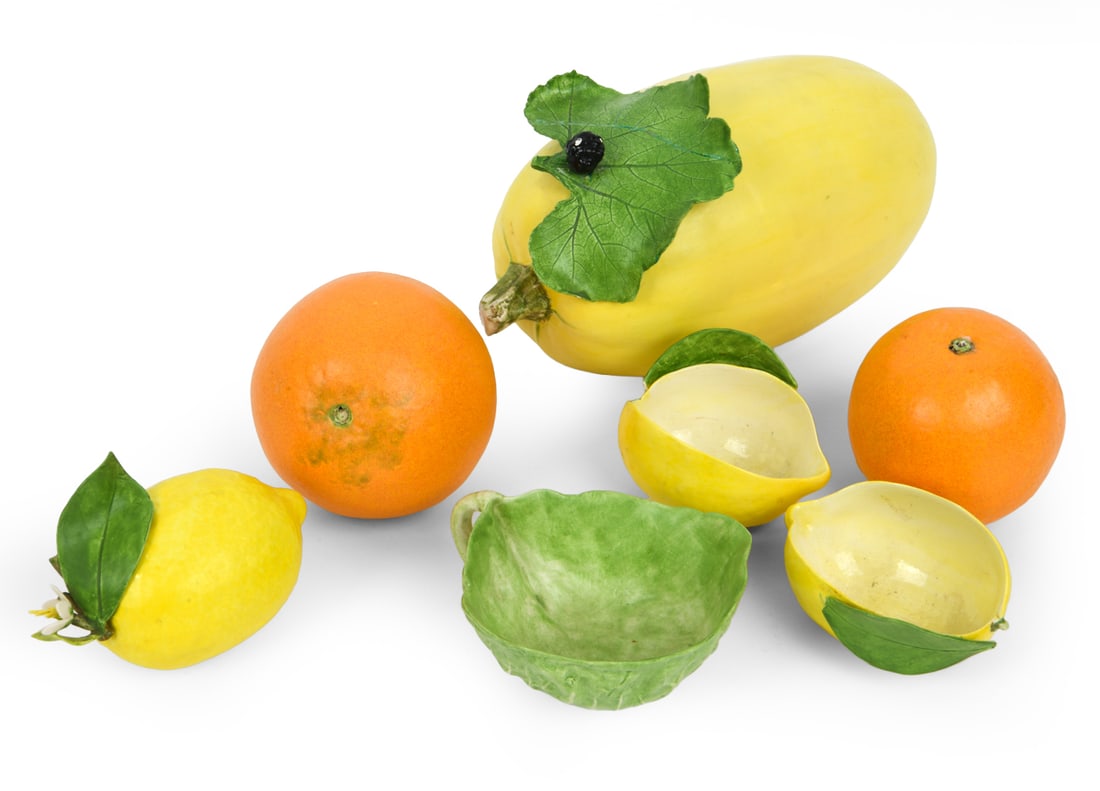 MARY KIRK KELLY CERAMIC PORCELAIN FRUIT GROUPING: Each fruit signed underneath. Dimensions: Largest H 5.5" x W 8.75" x D 4.5". Condition: Light scuffs. Wear consistent with age and use.