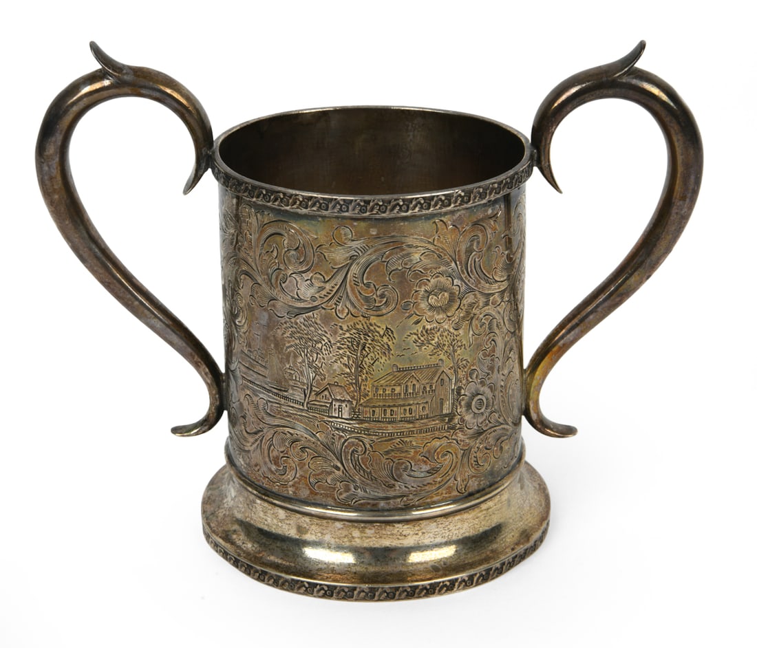 SILVERPLATED CHRISTENING MUG BY LEE AND WIGFULL: Makers mark on bottom. Made by Lee and Wigfull in Sheffield, England, circa mid 19th century. Christening inscription on front. Dimensions: H 5" x W 6.5" Condition: Natural patina, dents on bottom.