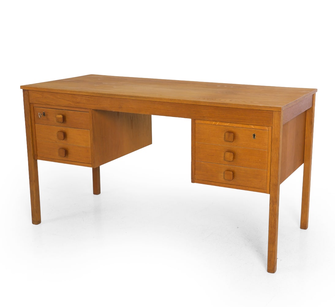 DANISH TEAK WRITING DESK C. 1960S: Key included. Dimensions: H 28.75" x W 52.25" x D 23.5". Condition: Sun fading to top. Wear consistent with age and use. F175