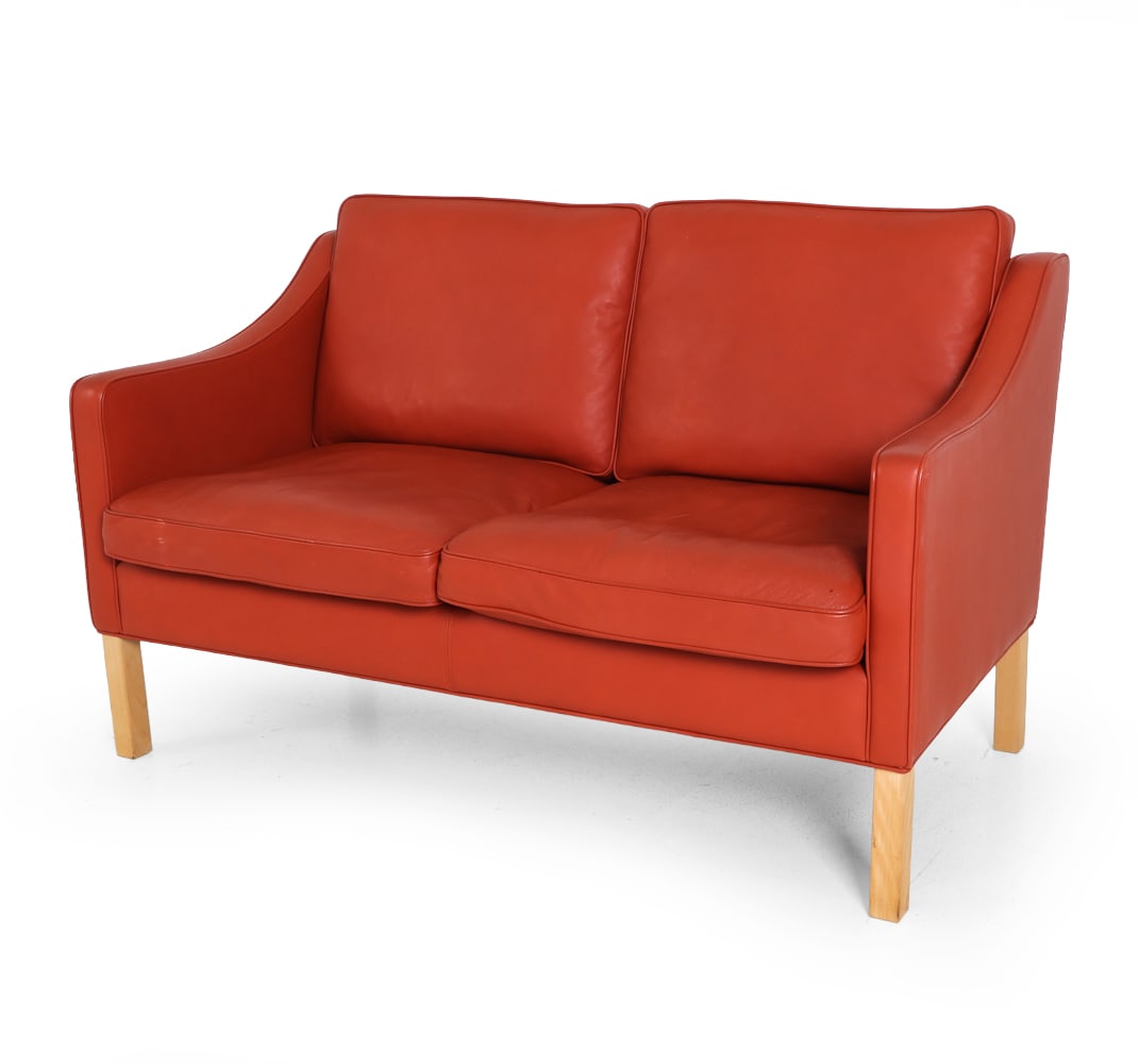 HURUP DANISH LEATHER LOVESEAT SOFA: Beech legs and leather upholstery. Denmark. Tagged to side. Dimensions: H 31.5" x W 54.25" x D 31" x SH 17" Condition: Wear consistent with age and use. Scuffs, rubs, to upholstery. F019