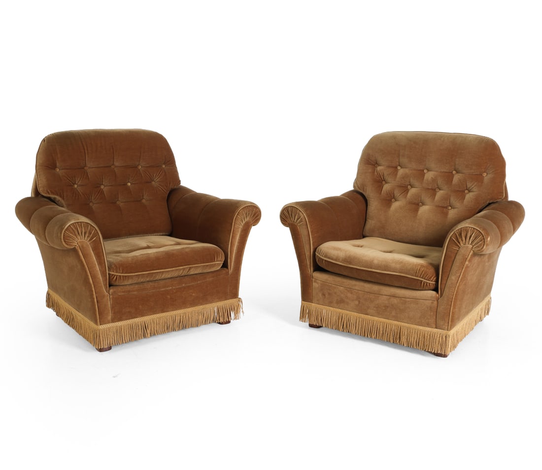 (2) DANISH VELOUR LOUNGE CHAIRS C. 1970S: Beech legs, Button tufted backs, fringe skirt, circa 1970s Dimensions: H 31.25" x W 28.25" x D 25.25" x SH 16" Condition: Minimal scuffs on legs, wear consistent with age and use.