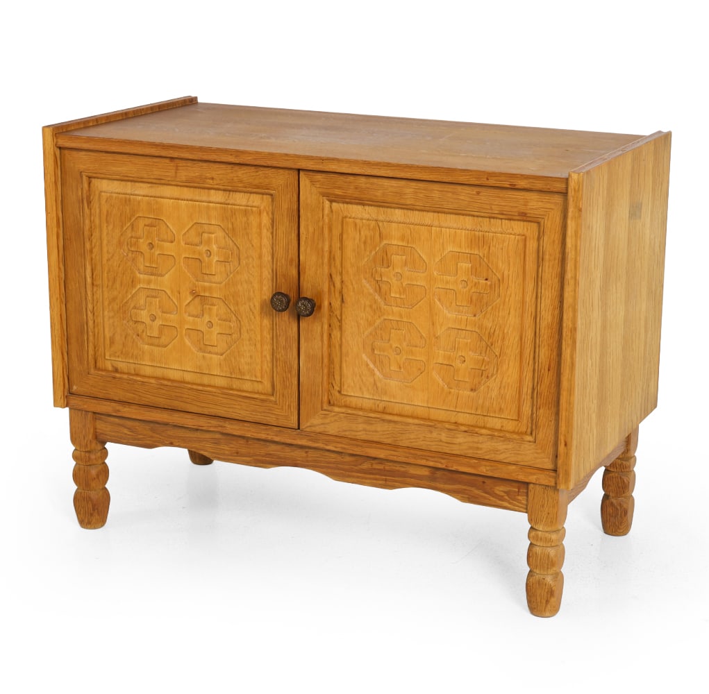 HENNING KJAERNULF STYLE DANISH CARVED OAK CABINET: Denmark, circa 1960s. Dimensions: H 25.5" x W 33.75" x D 17". Condition: Tobacco odor. Wear consistent with age and use. F136