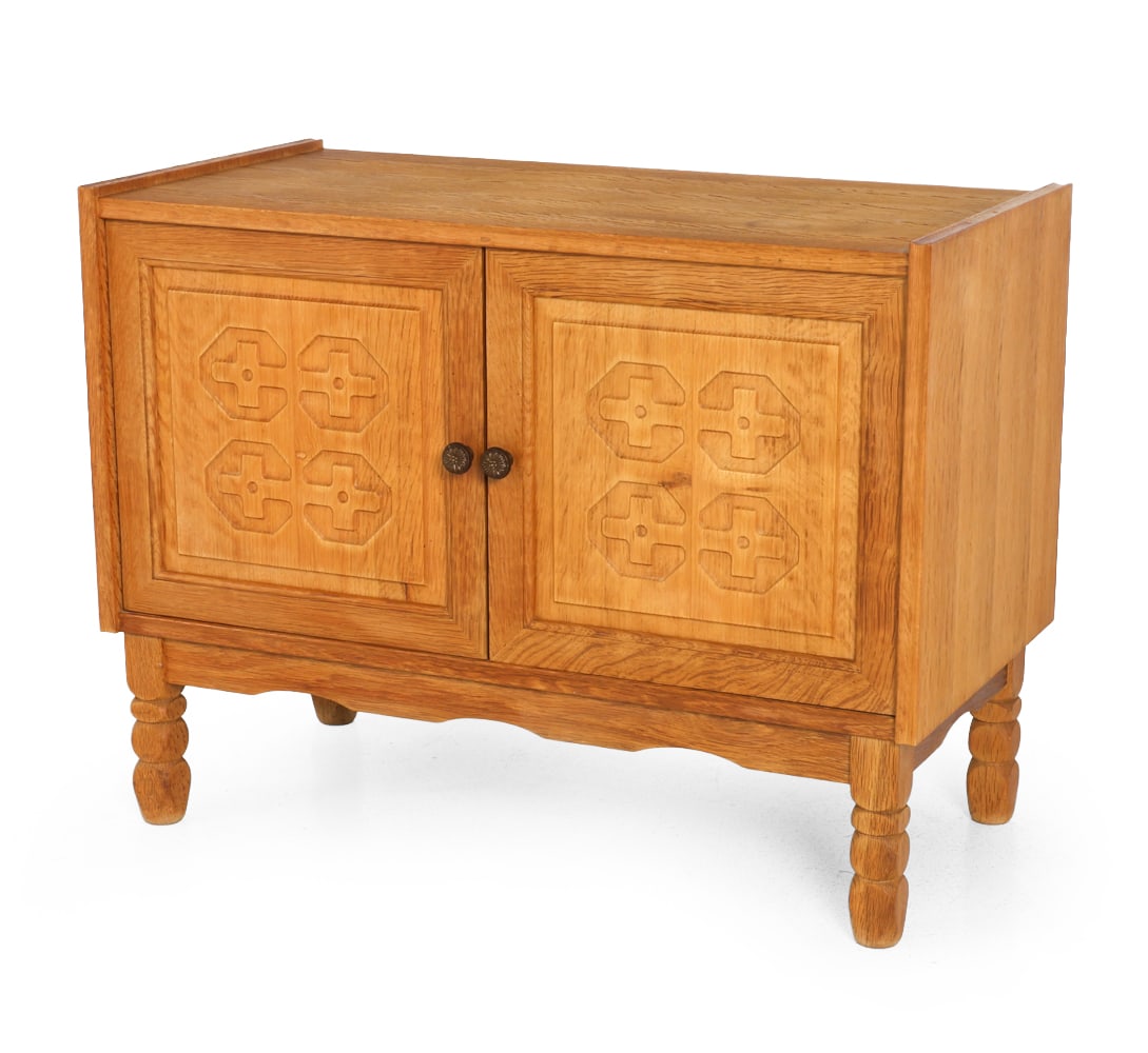 HENNING KJAERNULF STYLE DANISH CARVED OAK CABINET: Denmark, circa 1960s. Dimensions: H 25.5" x W 33.5" x D 17.25". Condition: Tobacco odor. Water rings. Wear consistent with age and use. F135