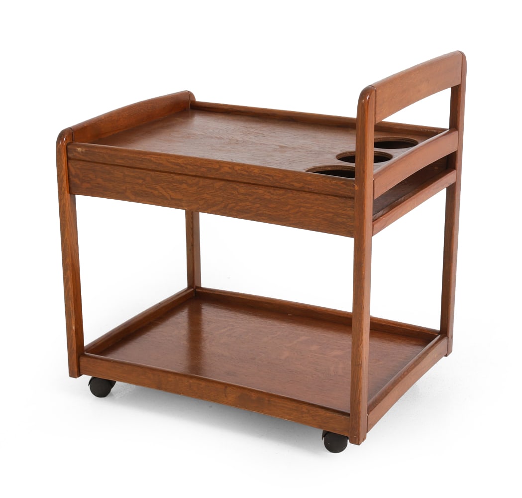 SCANDINAVIAN OAK WINE BAR CART C. 1970S: Stained oak cart. With bottle holder spots. Circa 1970s. Dimensions: H 25" x W 23.5" x D 17" Condition: Wear consistent with age and use. Some rubs to corners, edges. Few marks to top. F117