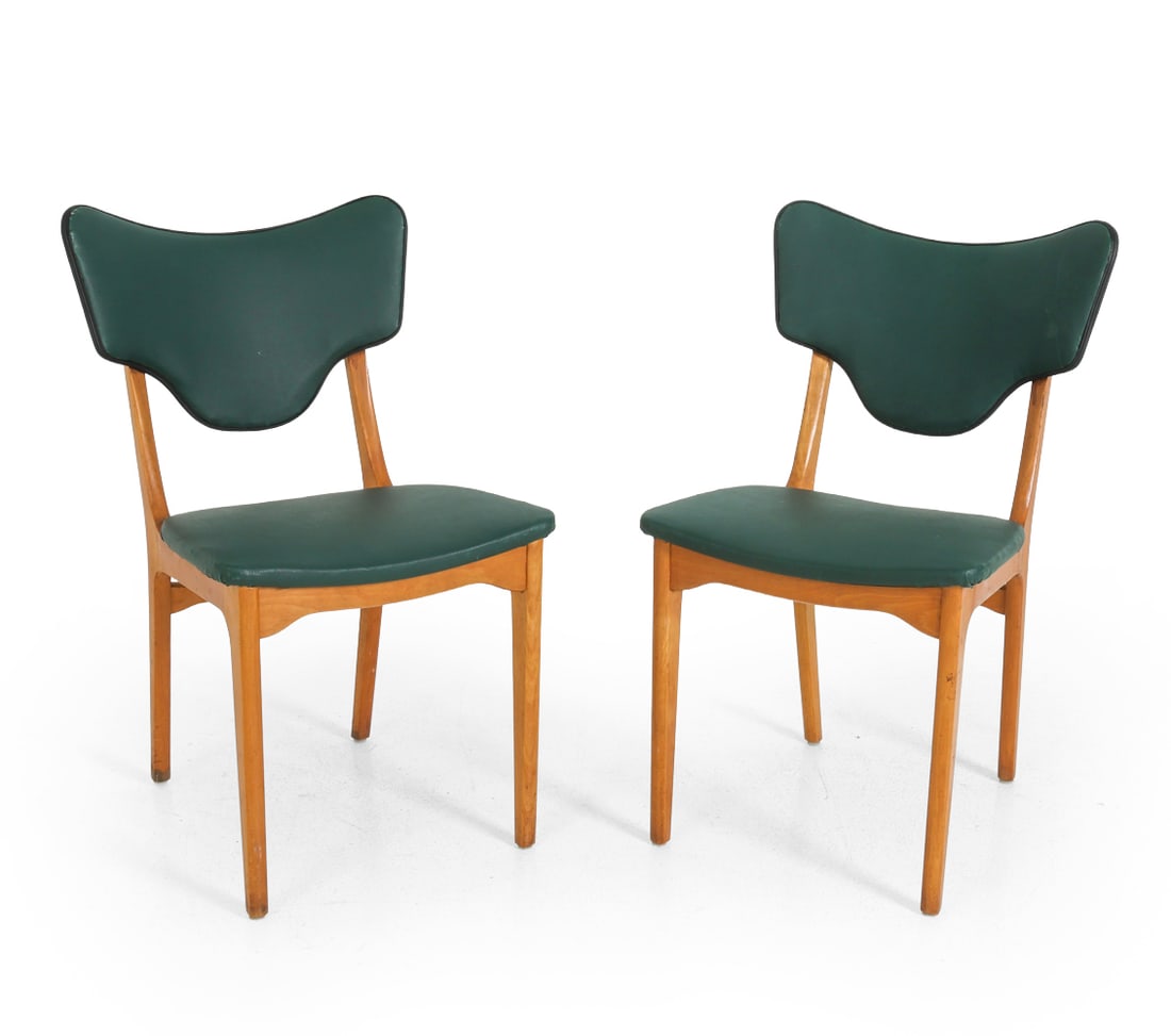 PAIR FINN JUHL STYLE DANISH LEATHER DINING CHAIRS: Dark green tone upholstery and beech frame. Denmark, circa 1970s. Dimensions: H 34" x W 18.5" x D 17.25" Condition: Scuffs and watermarks on wood. Wear consistent with age and use. Small tear to uphol