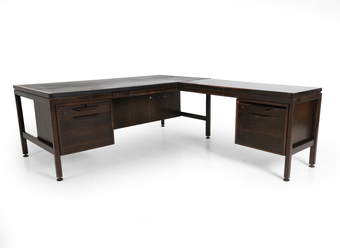 JENS RISOM LEATHER & WALNUT WRITING DESK C. 1970S: No key included. Leather top surface. Marked inside one drawer. Dimensions: As Shown H 29" x W 75" x D 88". Largest Section D 36". Condition: Dings and rubs to table top and legs. Loss to finish.