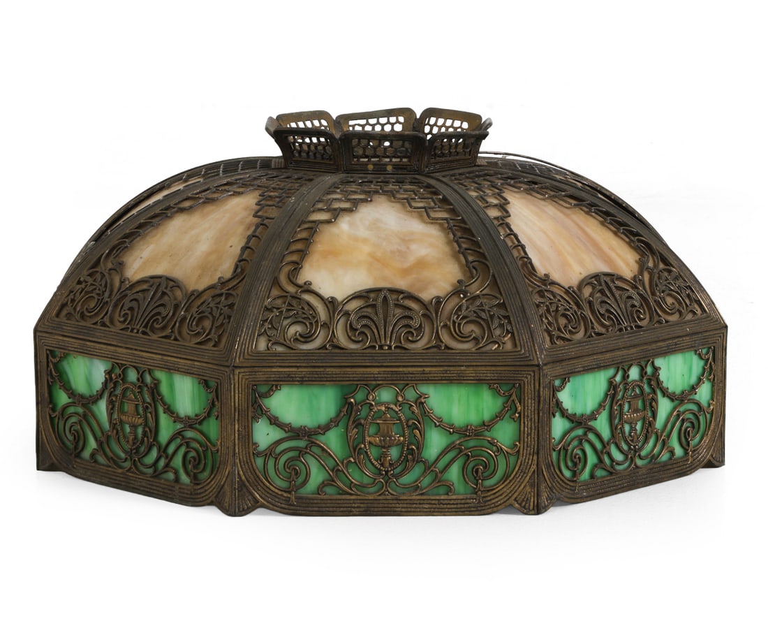 ANTIQUE BRADLEY AND HUBBARD STYLE SLAG GLASS SHADE: Early 20th century. Unmarked Dimensions: H 11" x Dia. 21.5". Condition: Oxidation to frame. Surface soiling. Wear consistent with age and use.