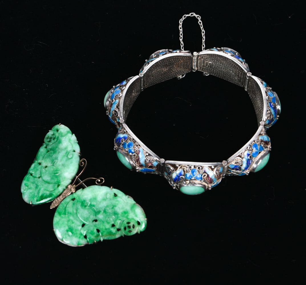JADE & STERLING BUTTERFLY AND ENAMEL JADE BRACELET: Grouping features a jade butterfly brooch and a colorful sterling, jade and enamel bracelet with butterfly motif. Marked sterling. Total weight: 1.6ozt Dimensions: (Bracelet) Dia 3" Condition: Some ta