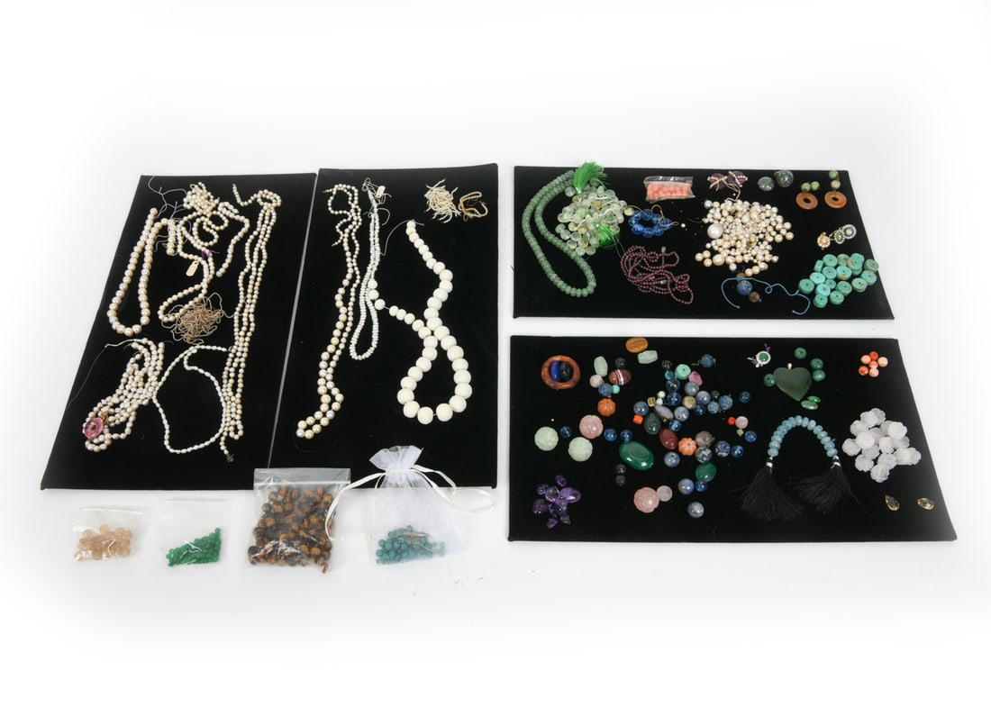 COSTUME JEWELRY GROUPING: Grouping of various costume jewelry pieces, including loose stones. 20th century. Condition: Small losses, missing clasps. Wear consistent with age and use.