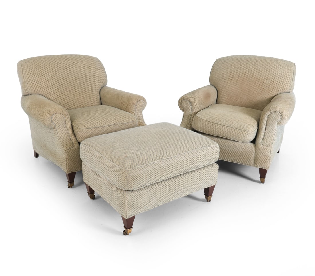 PAIR OF KRAVET FURNITURE LOUNGE CHAIRS W/ OTTOMAN: Two lounge chairs with beige and green tone upholstery and round arms. Features brass casters. Labeled under the cushions. 20th century. Dimensions: H 34" x W 28" x D 32" x SH 18" (Ottoman) H 18" x W