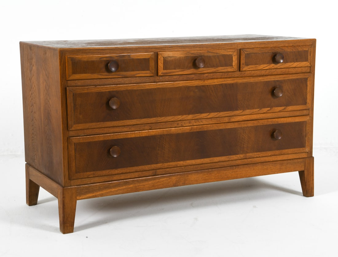 DANISH OAK CHEST OF DRAWERS C. 1950S: Low chest of drawers in stained oak frame with round drawer pulls. Denmark, circa 1950s. Dimensions: H 23.75" x W 39.5" x D 17.5" Condition: Wear consistent with age and use, including minor rubs and