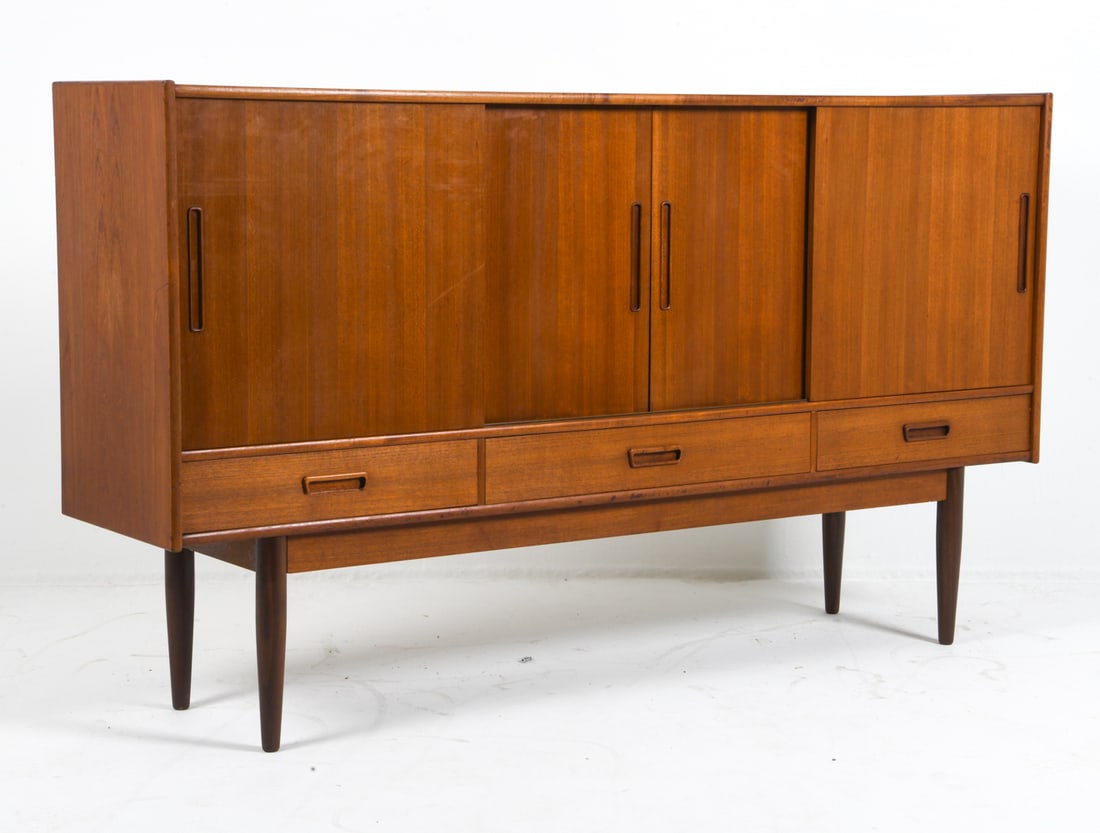 DANISH TEAK SIDEBOARD C. 1970S: Teak cabinet with sliding doors. Dry bar to center cabinet with frosted mirror backing. Adjustable shelves. Denmark, circa 1970s. Dimensions: H 44" x W 77" x D 17.5". Condition: Few scuffs and