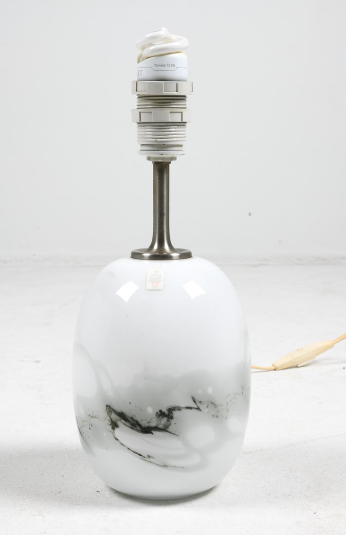 MICHAEL BANG HOLMEGAARD 'SAKURA' TABLE LAMP: Glass table lamp with abstract design. Tagged underneath. Denmark, circa 1980s. Dimensions: H 12.5" x Dia 5". Condition: Wear consistent with age and use. Wiring untested, European plug.