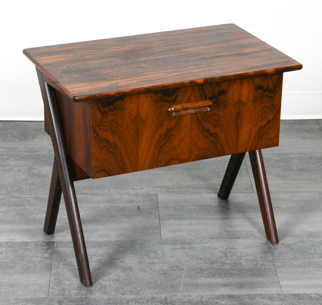 DANISH ROSEWOOD SEWING CHEST C. 1960S: Rosewood sewing chest with x-shaped base. Organizing trays inside drawer. Denmark, circa 1960s. Dimensions: H 21.5" x W 25.5" x D 16". Condition: Scuffs to legs. Wear consistent with age and use.