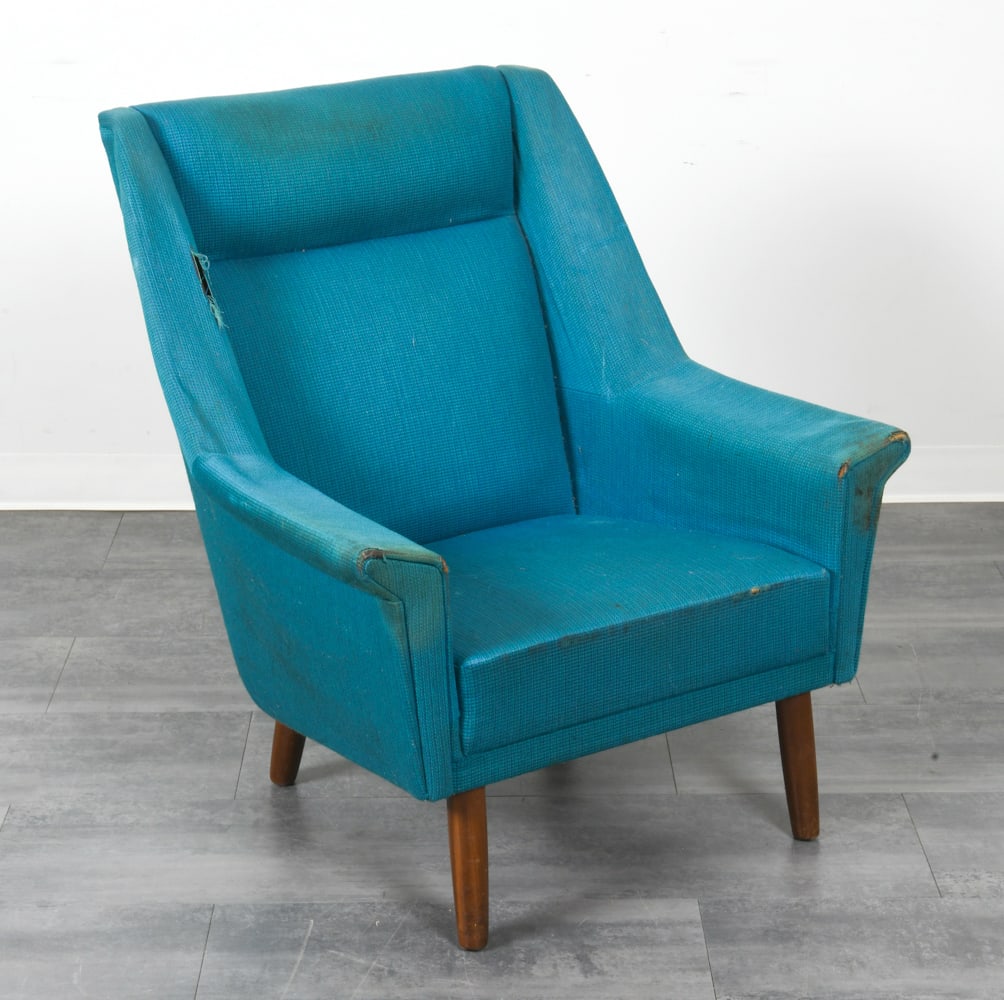 SCANDINAVIAN WOOL LOUNGE CHAIR C. 1960S: Lounge chair with blue wool upholstery and tapered teak legs. Scandinavian, circa 1960s. Dimensions: H 36.5" x W 32" x D 27" x SH 16". Condition: Tears to fabric on arms with fading, reupholstering