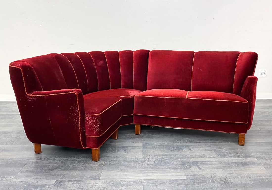 DANISH RED VELOUR SECTIONAL SOFA: Sofa is in (2) detachable sections. Denmark. Dimensions: H 31" x W 63" x D 42" x SH 17.5". Condition: Scratches and dings to legs, some surface soiling. Wear consistent with age and use.