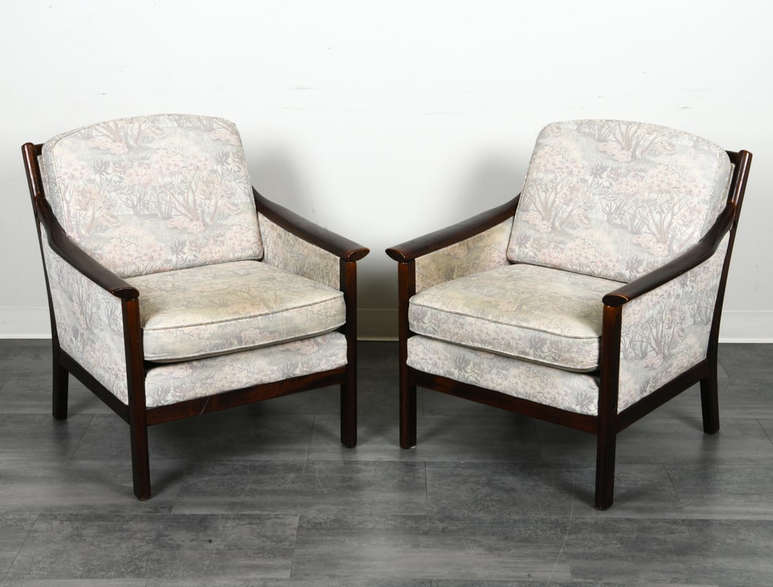 PAIR OF DANISH BEECH LOUNGE CHAIRS: Beech frames in dark stain with nature patterned fabric. Denmark, Late 20th c. Dimensions: H 30.25" x W 27.5" x D 27.5" x SH 17.5". Condition: Rubs to edges of wood. Wear consistent with age and use.