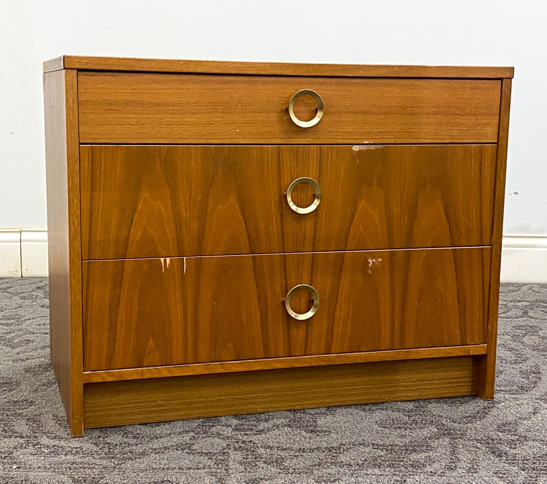 STYLE OF ULFERTS TEAK CHEST OF DRAWERS: Dimension: H 21.75" x W 27.5" x D 17" Condition: Loss to proper left side trim, losses of veneer to face of drawer, Rubs and scuffs to top and sides, Wear consistent with age and use.