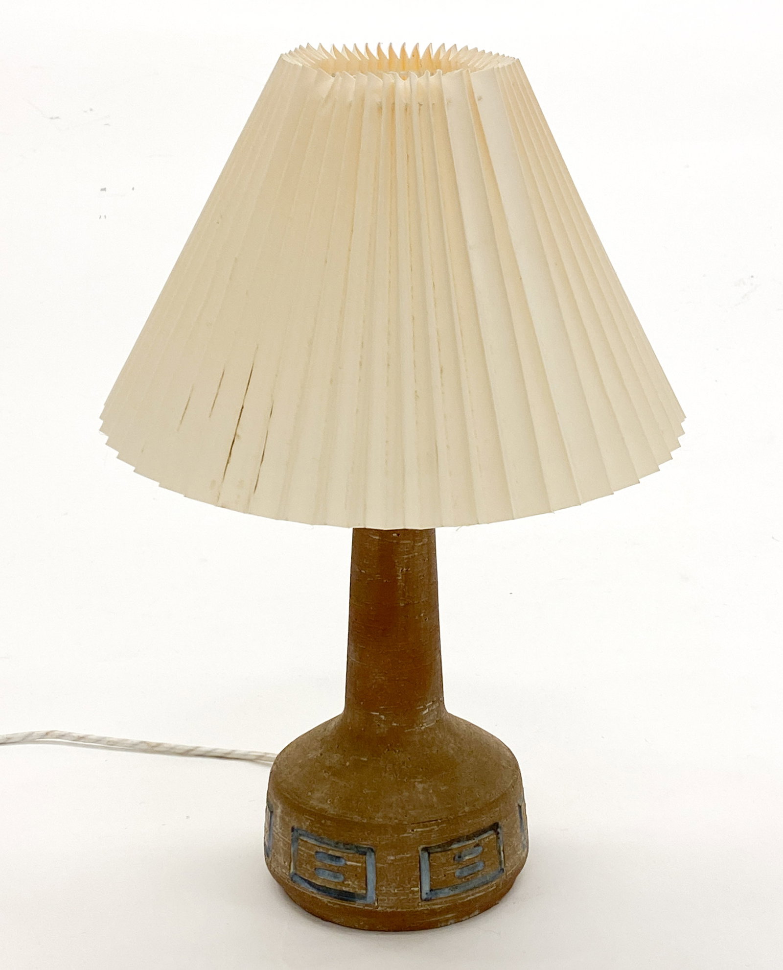 BARTHOLDY FM9 DANISH CERAMIC TABLE LAMP C. 1960S: Marked underneath. Includes pleated shade. Dimensions: H 17" x Dia 15" (Shade) Condition: Wear consistent with age and use. Wiring untested. European plug, Scuffs to shade with minor soling spots.