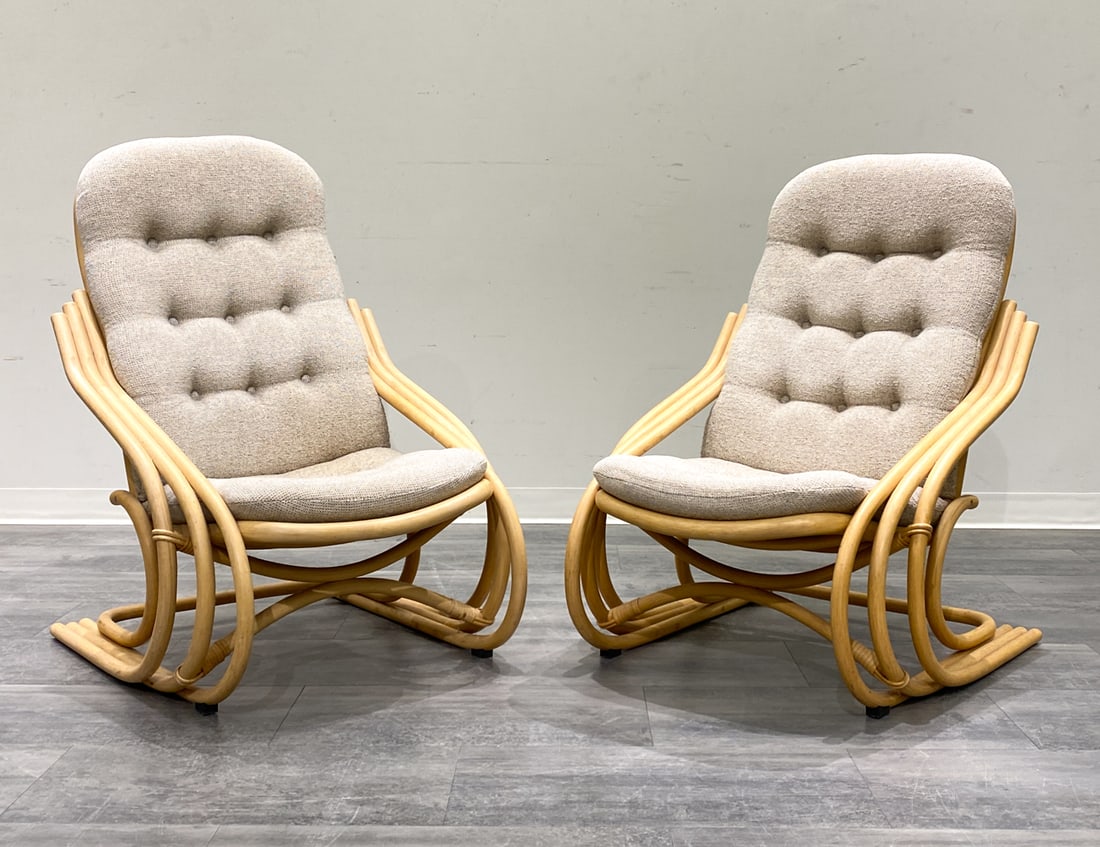 PAIR DANISH BAMBOO LOUNGE CHAIRS 1970S: Bamboo frame and tufted cushions. Scandinavian, circa 1970s Dimensions: H 39'' x W 27'' x D 32'' x SH 16'' Condition: Wear consistent with age and use. Minor scuffs. Fading to upholstery.